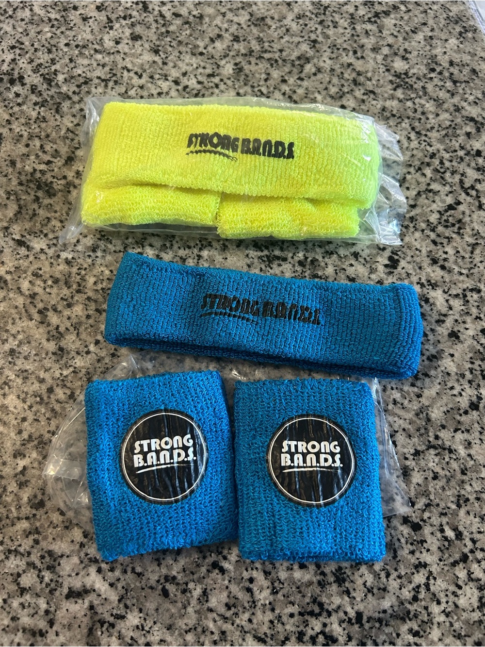 NEW - wristbands branded with "STRONG B.A.N.D.S."